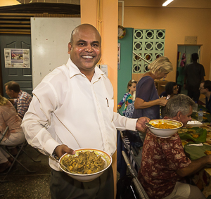 Jesse helping to hand out food at Diwali, Festival of Lights, Trinidad